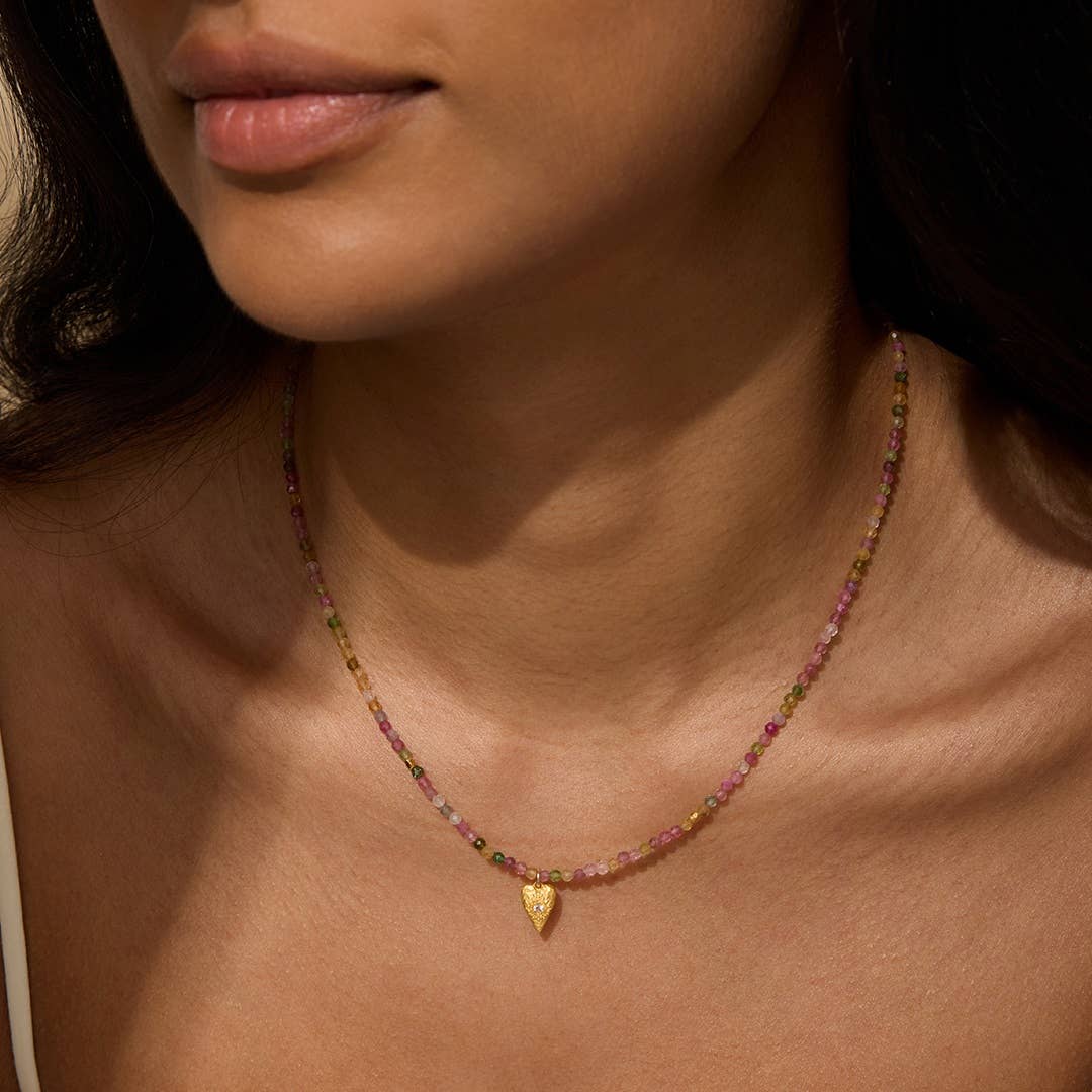 Pink Tourmaline Heart Choker Necklace with a heart-shaped pendant worn by a person