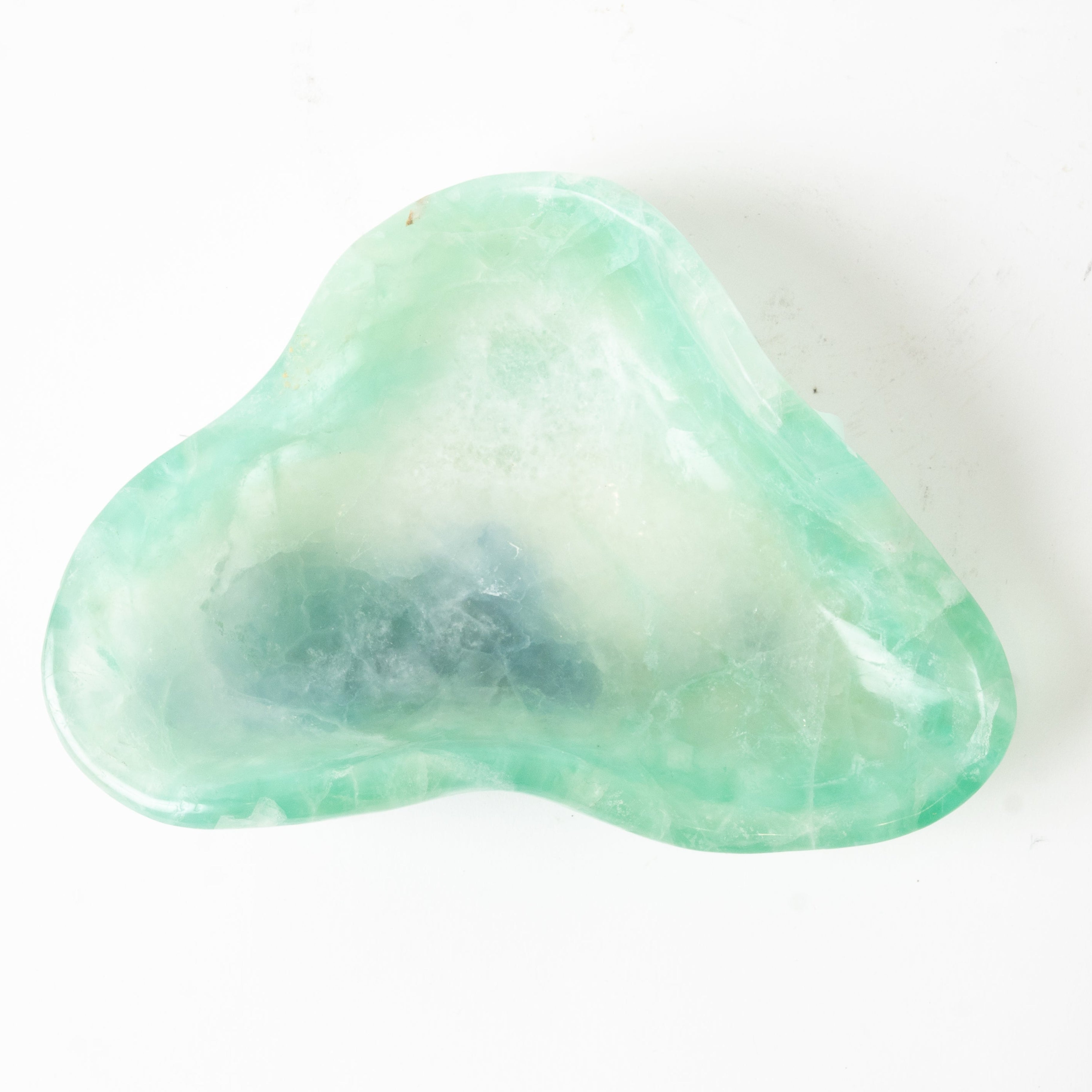 Green fluorite crystal bowl on a white background