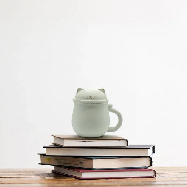 Lucky Cat Mug w/ Strainer & Lid, White, on Books