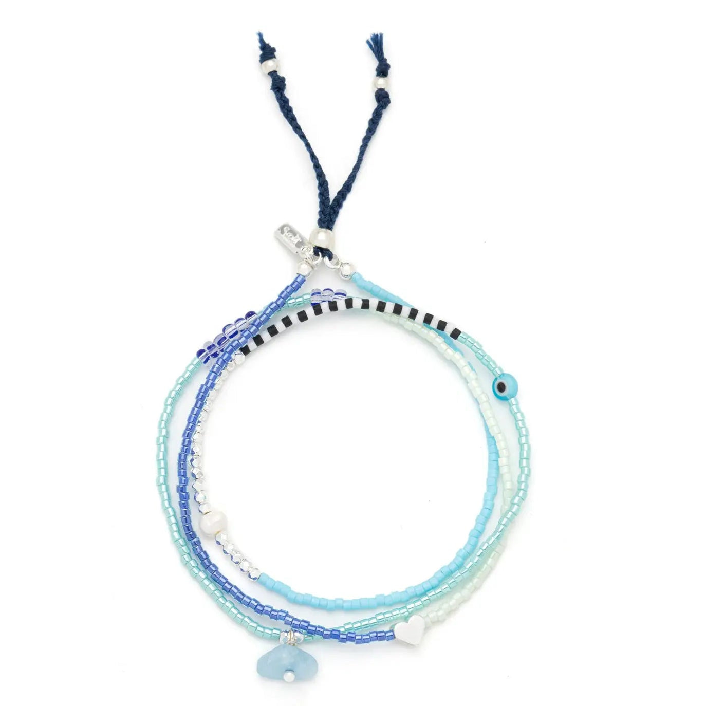 Multistrand aquamarine bracelet with blue, white, and black beads on a white background