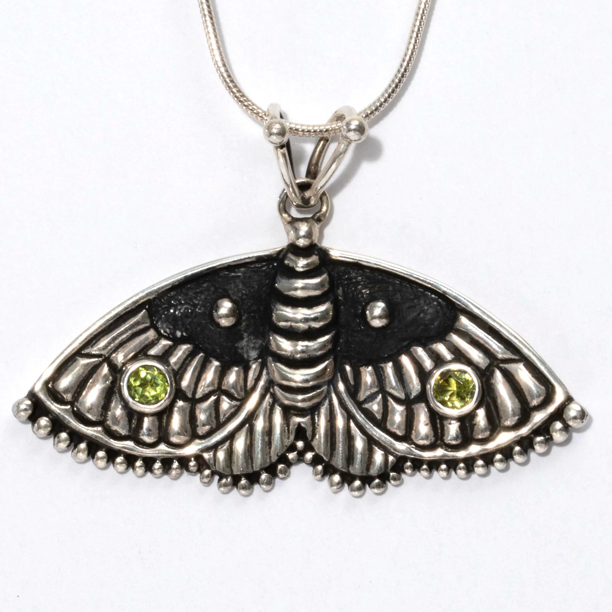 Moth Pendant with Peridot Oval and Quote on back front