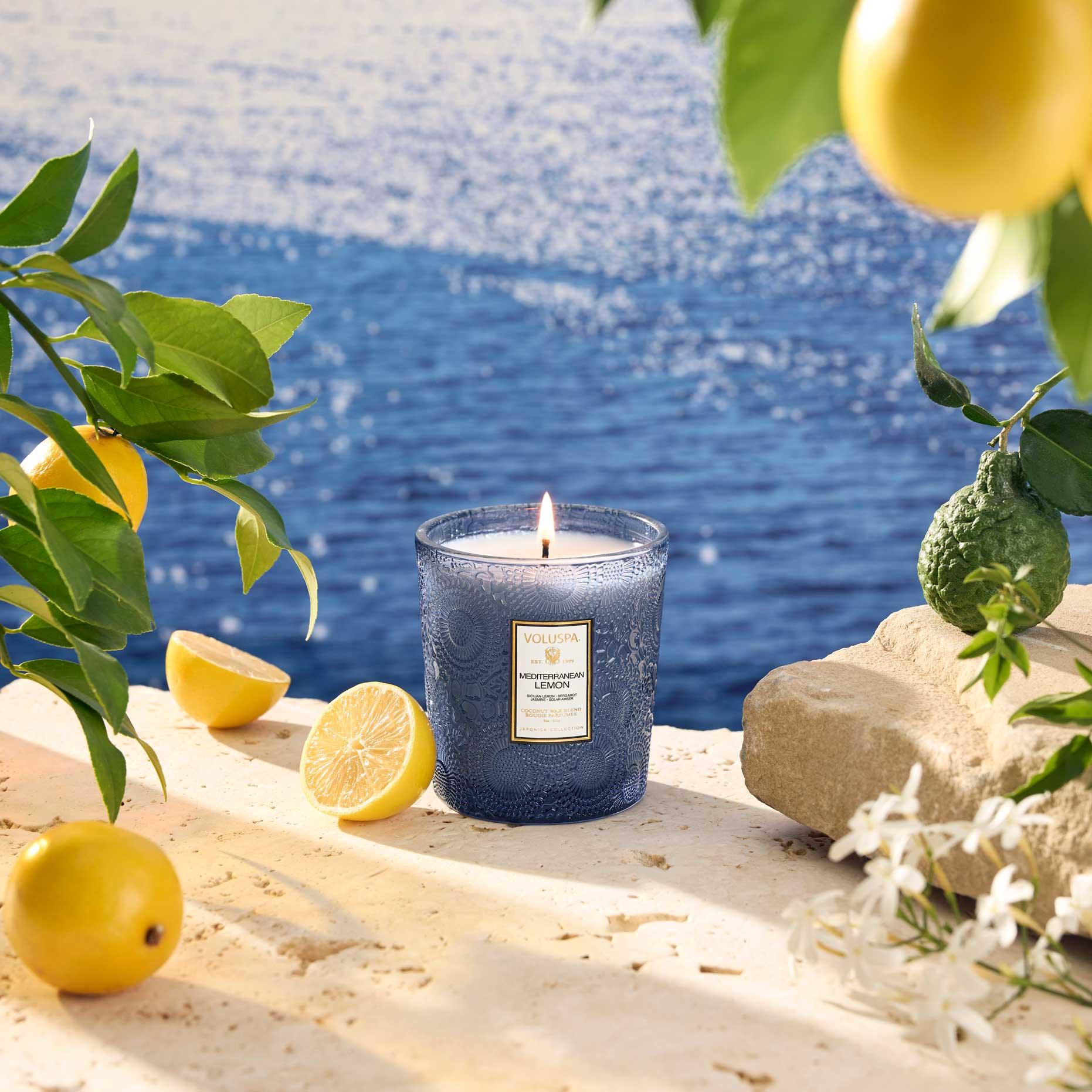 Mediterranean Lemon Classic Candle 9 oz with an ocean background