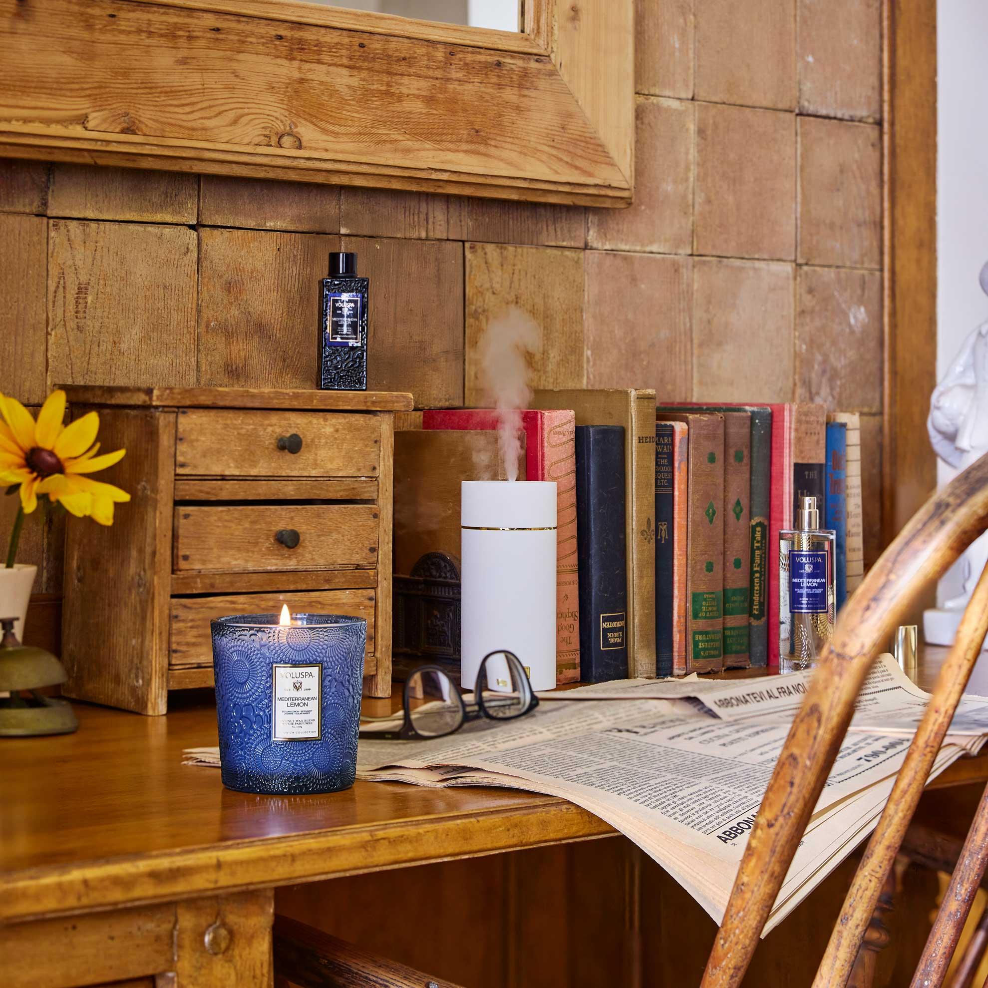 Mediterranean Lemon Classic Candle 9 oz on a desk