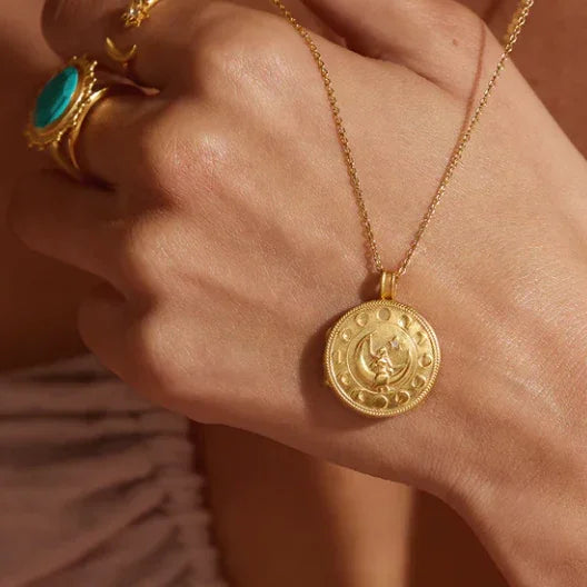 Mother Moon Locket Necklace Gold in hand