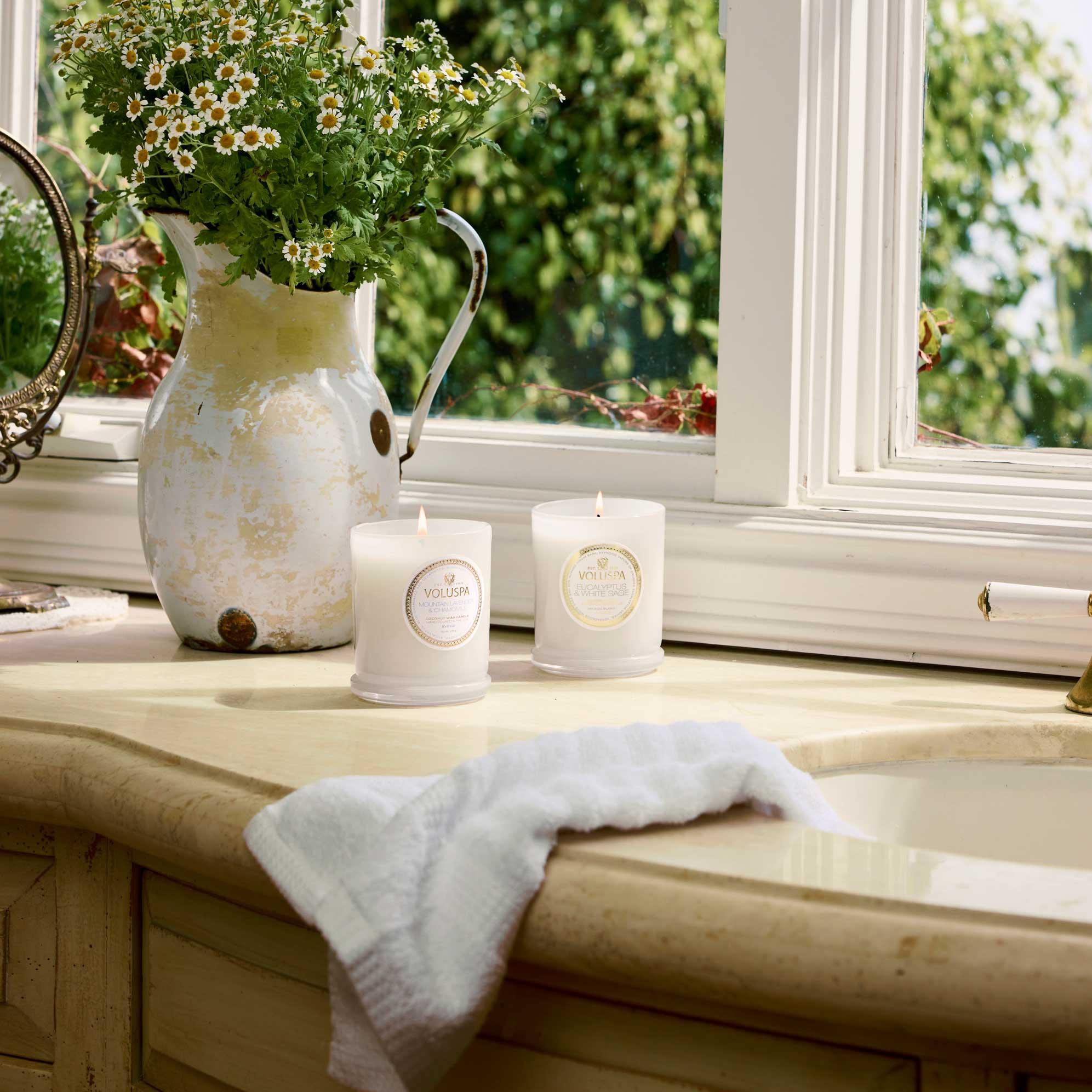 Mountain Lavender and Chamomile Classic Candle 9.5 oz on sink counter