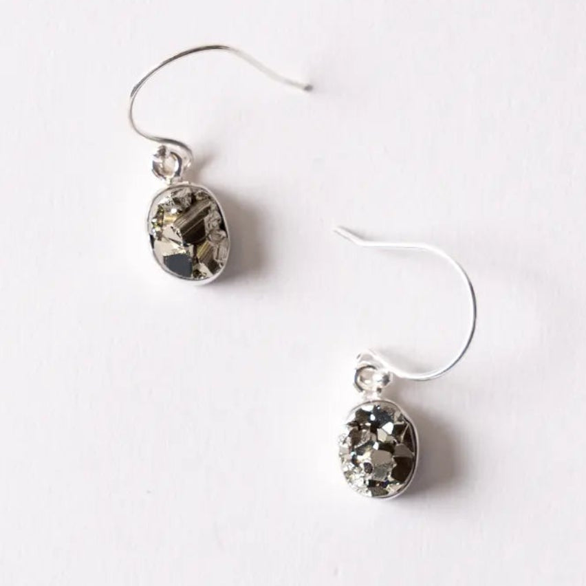 Pair of Pyrite earrings on a white background