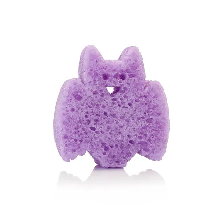 Purple bath bomb shaped like a cat on a white background
