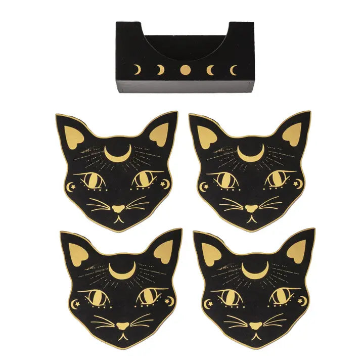 Four black cat-shaped coasters with gold celestial details are arranged below a matching black rectangular tray featuring moon phases, all on a plain white background.