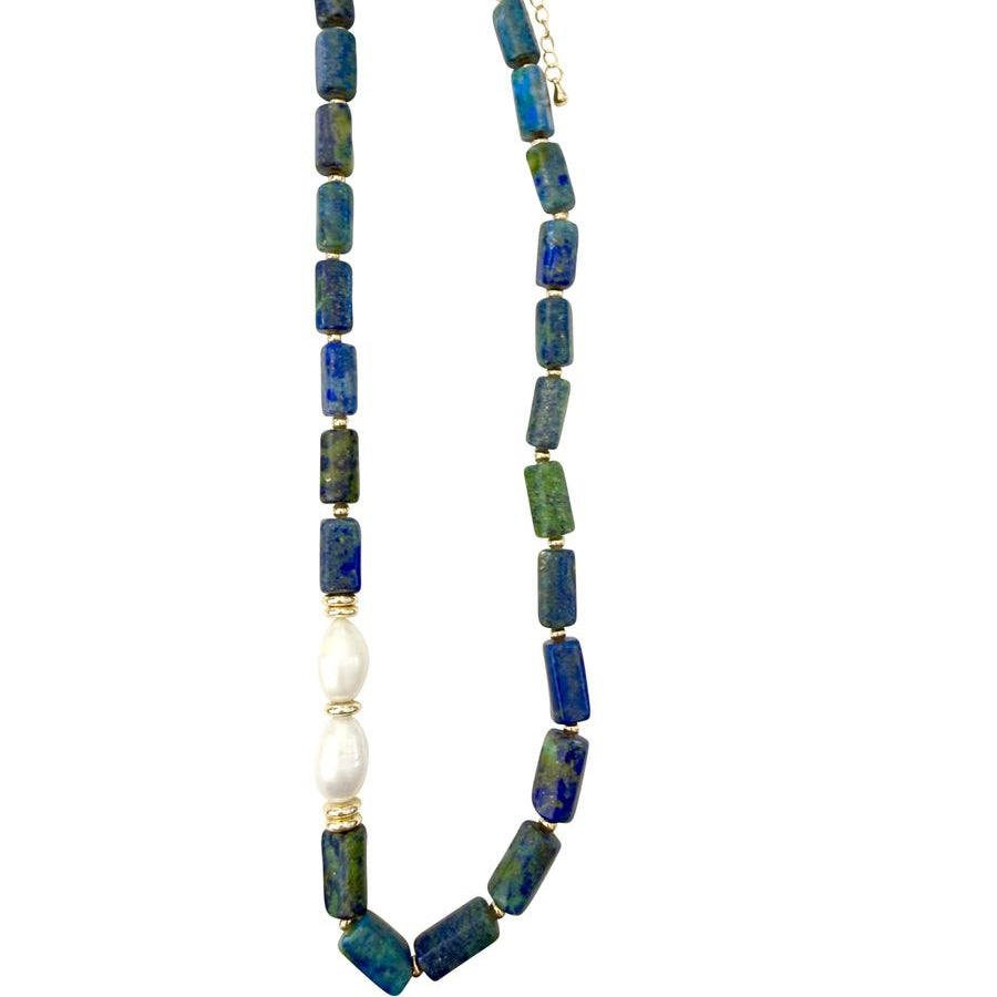A beaded necklace featuring rectangular azurite and malachite stone beads, a single white pearl, and gold spacer rings and clasp, displayed on a clean white background.