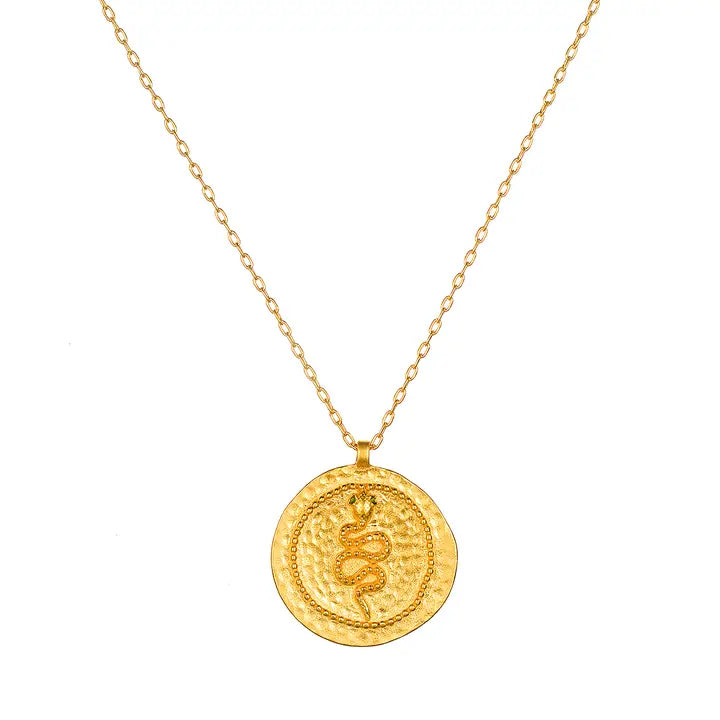 Gold necklace with a round snake pendant on a white background