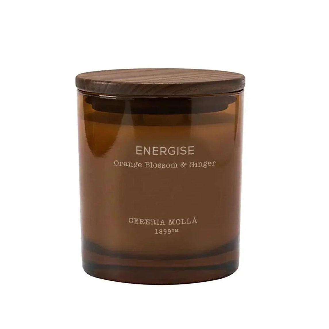 An amber glass jar candle with a dark brown wooden lid, featuring white text that reads 'ENERGISE Orange Blossom & Ginger' and 'CEREALIA MOLLA 1899'.