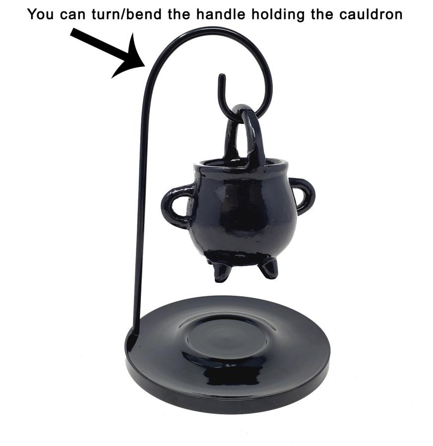 Black cauldron with a handle on a white background