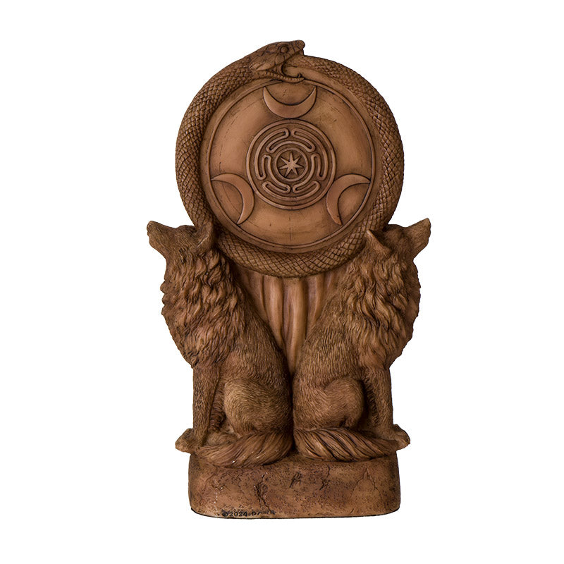 Wooden sculpture of two wolves flanking a circular emblem with a design on a white background