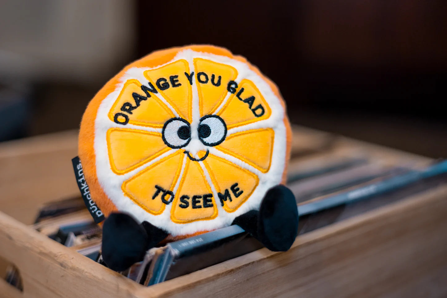 Orange You Glad to See Me Plush with background