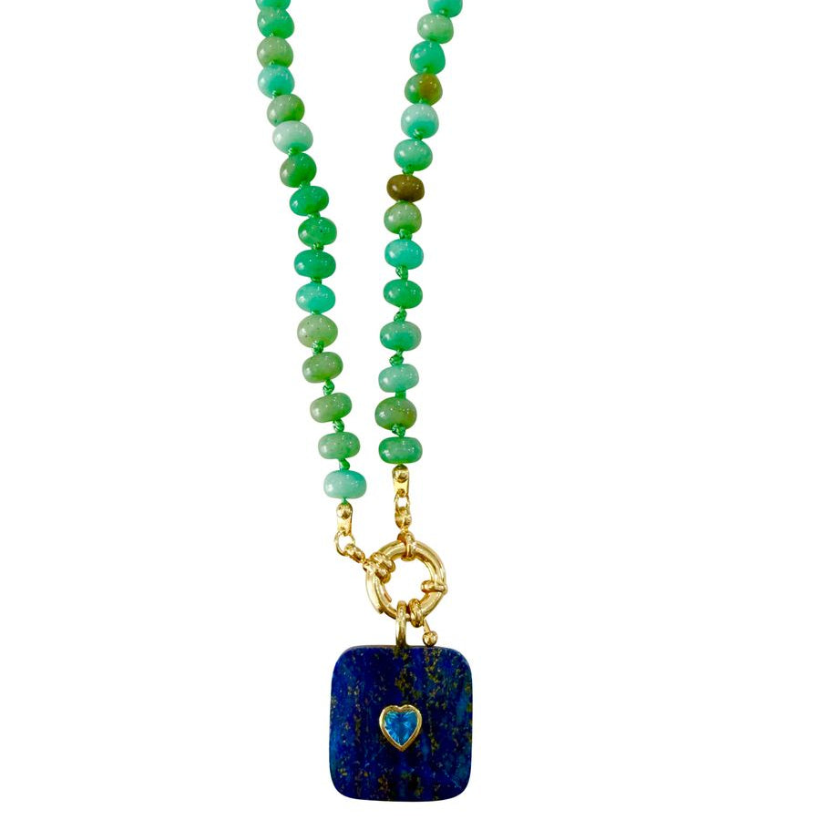 A beaded necklace featuring a strand of amazoite beads with a gold-tone clasp and a square dark blue lapis lazuli pendant with a small heart-shaped blue inlay.