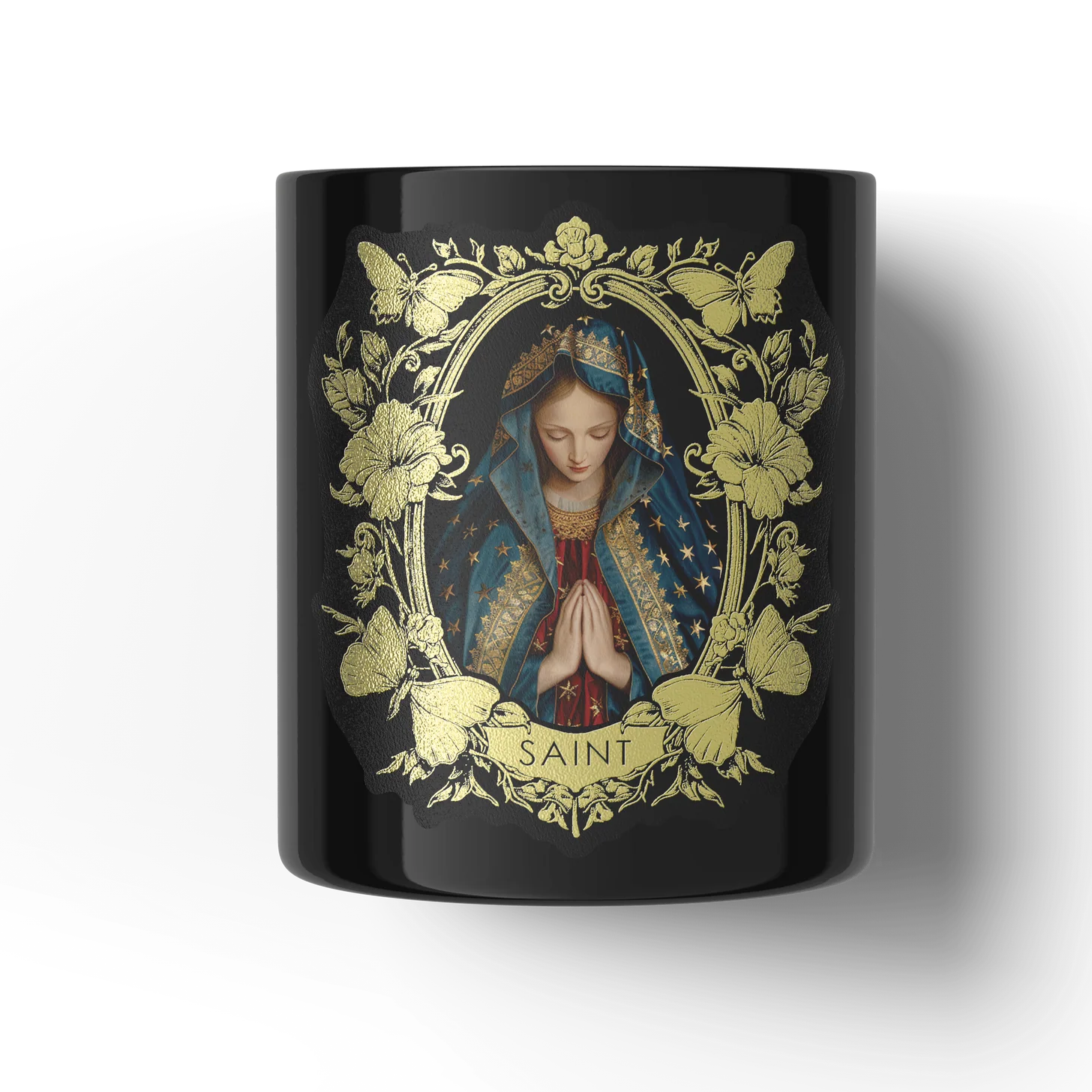 Black candle with a religious design featuring a figure in a floral frame and 'SAINT' text on a white background.