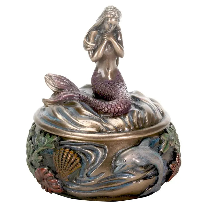 Decorative box with a mermaid on top of a shell, surrounded by dolphins and shells.