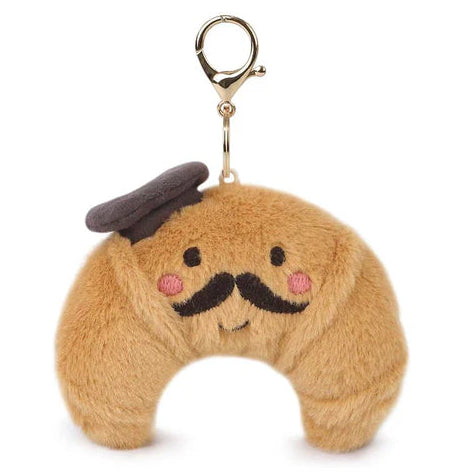 Plush keychain croissant with a mustache and top hat on a white background