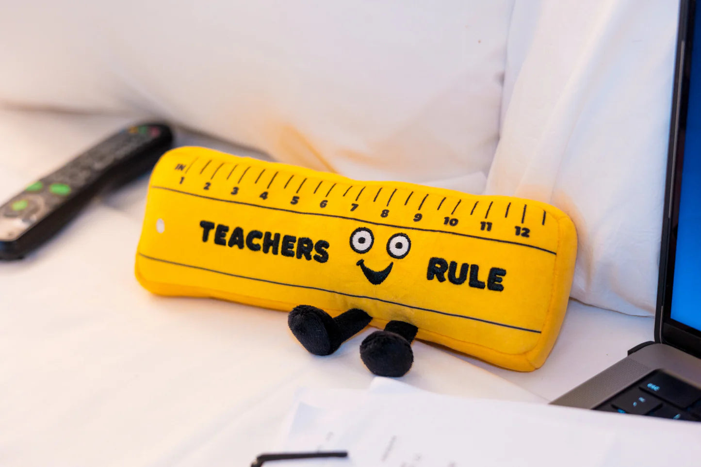 Teachers Rule - Ruler Plush on a sofa
