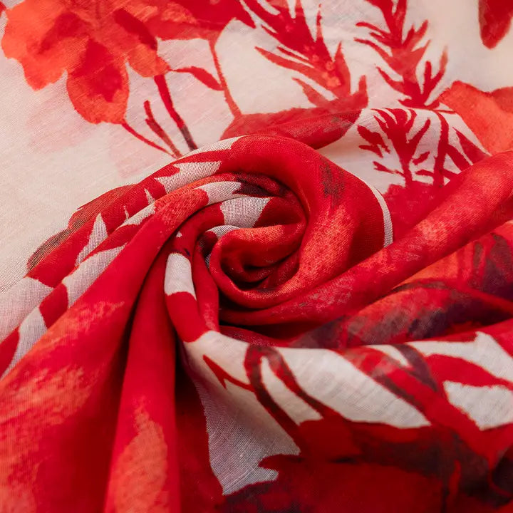 Red floral scarf with a close-up of a rolled-up piece.