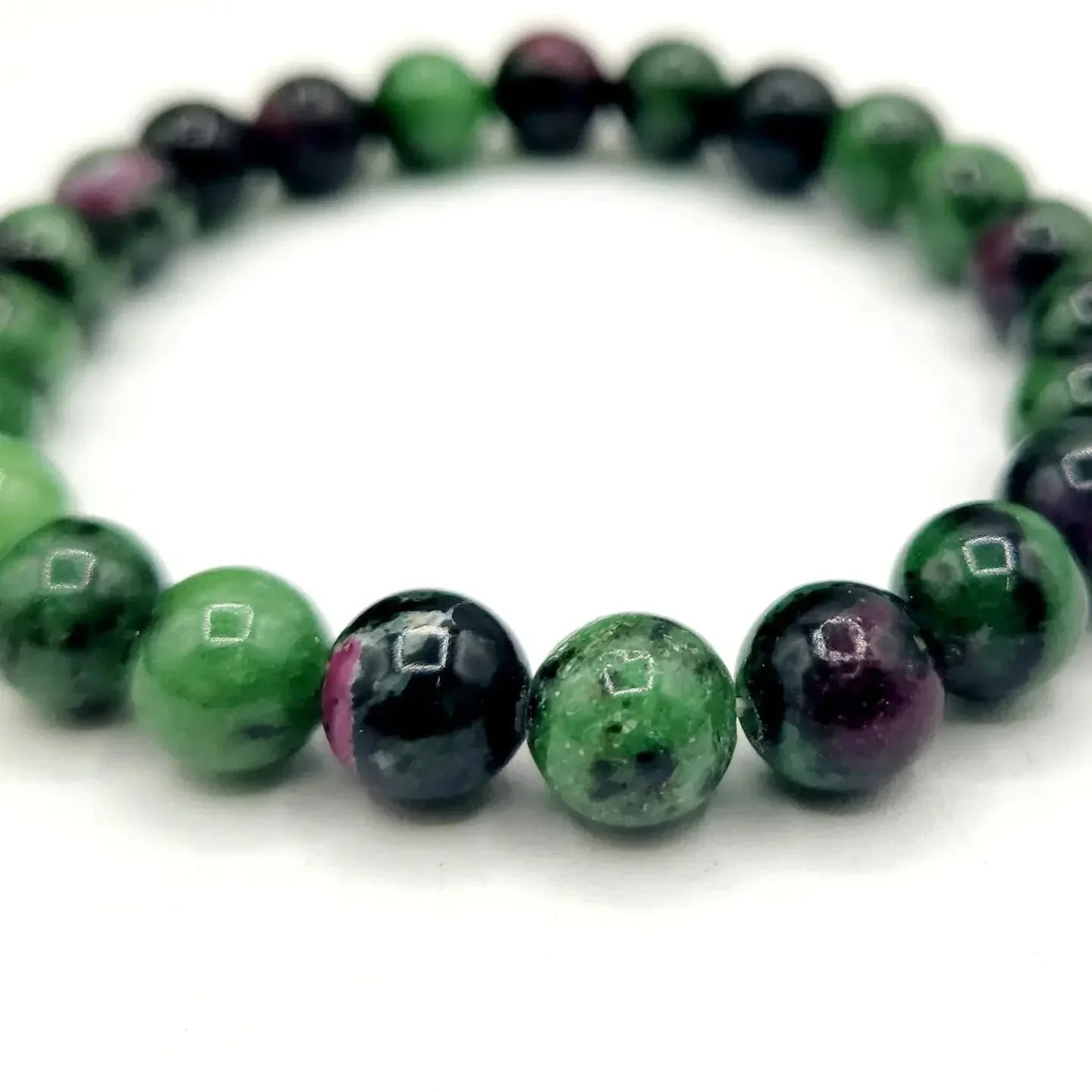 Ruby Zoisite 8mm Smooth Bead Stretch Bracelet Upclose