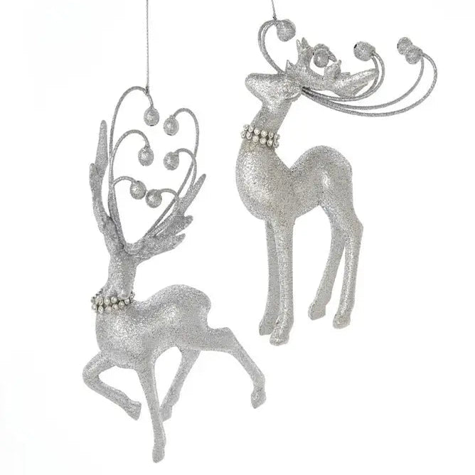 Two silver glitter reindeer hanging ornaments with decorative antlers and pearl-like necklaces, shown against a plain white background.