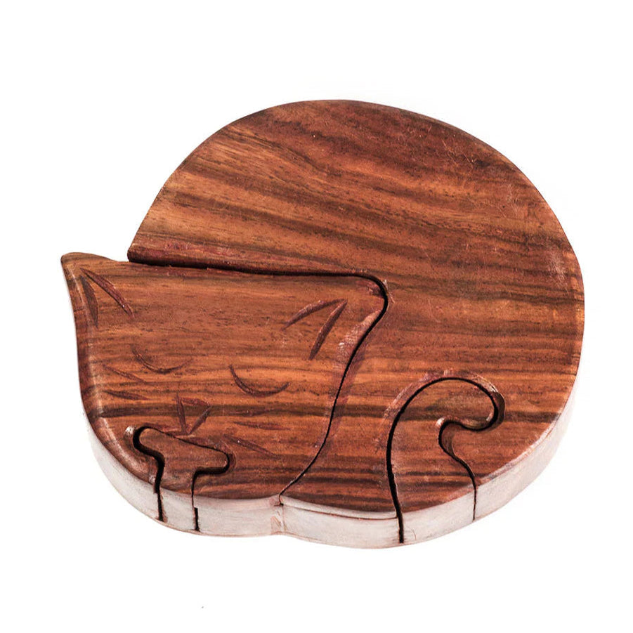 Wooden puzzle shaped like a cat on a white background
