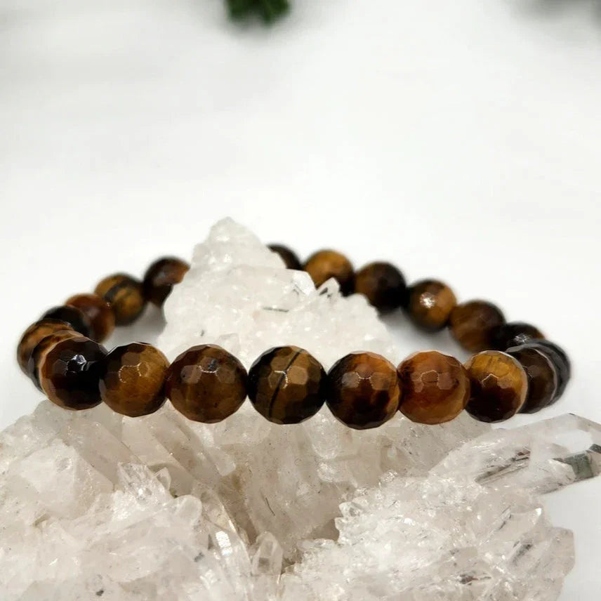 Tiger Eye Faceted Bead Stretch Bracelet on stone