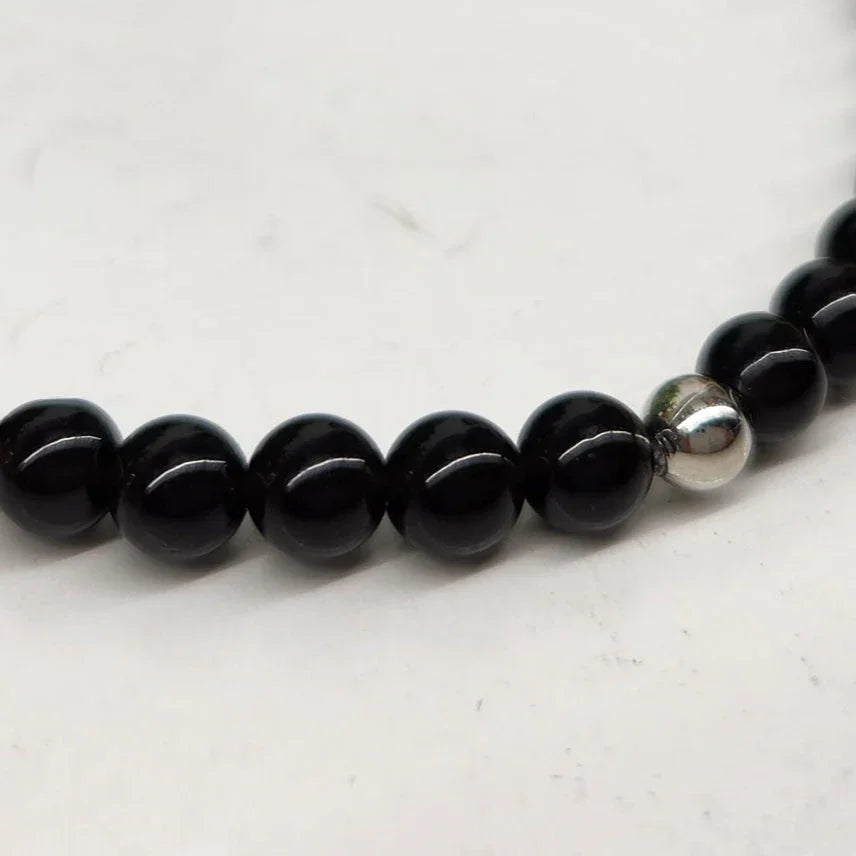Tourmaline Black 4mm Smooth Bead Stretch Bracelet closer view