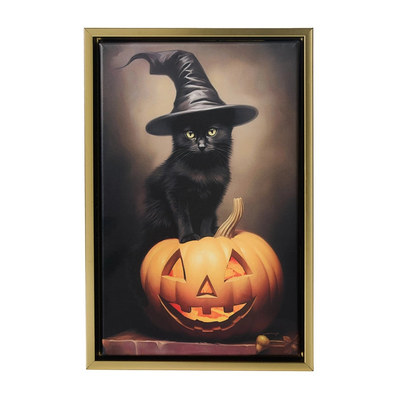 Halloween-themed artwork with a black cat and carved pumpkin in a gold frame.