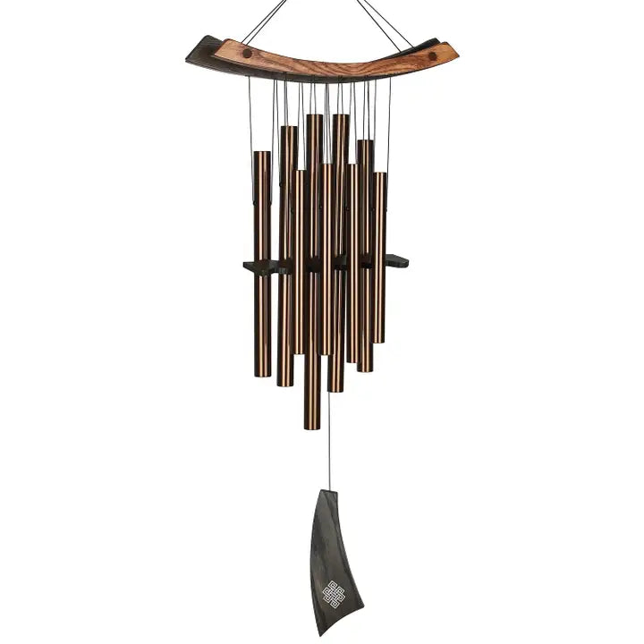 Decorative wind chime with wooden top and metal tubes on a white background