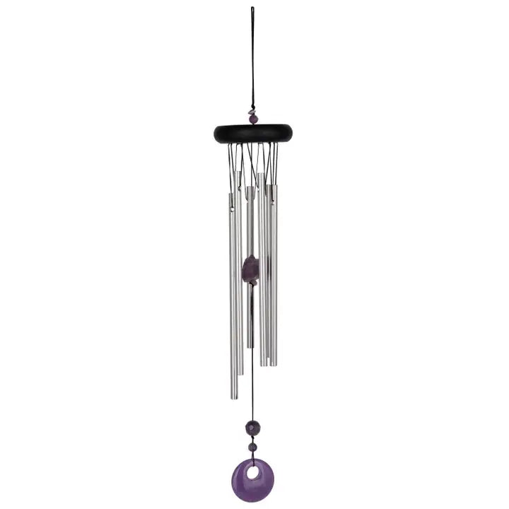 Decorative wind chime with purple accents on a white background