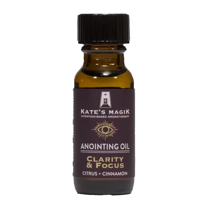 Bottle of Kate's Magik Anointing Oil for Clarity & Focus on a white background
