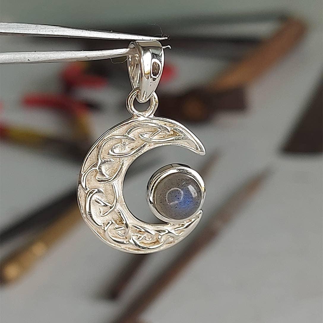 Labradorite Celtic Moon Pendant Being Held