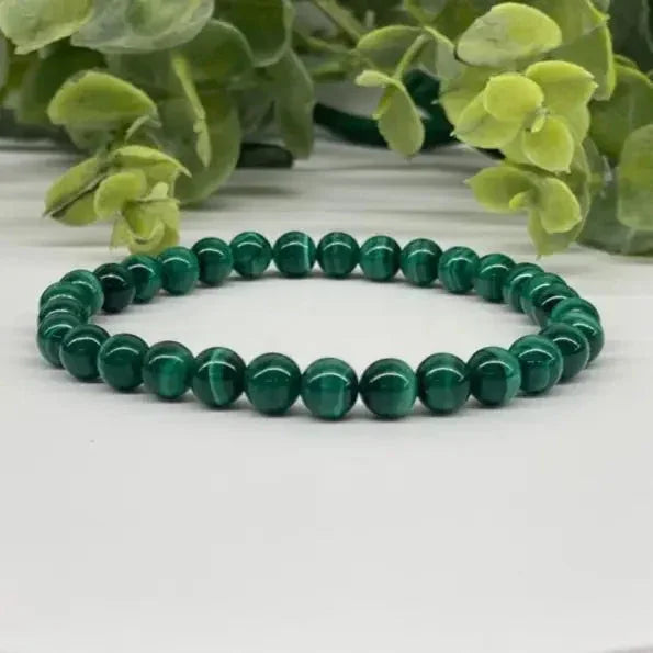 Malachite Smooth Bead Stretch Bracelet on white background