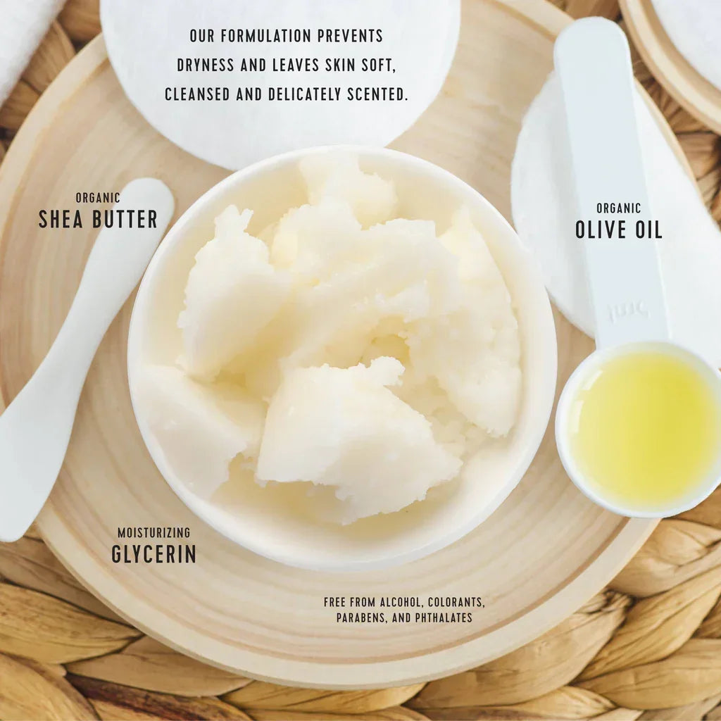 Ingredients Showing Bowl of shea butter with olive oil and text about product benefits on a wooden surface.