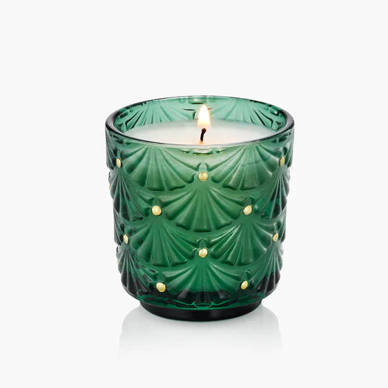 Noble Fir Green textured candle in a glass holder on a white background