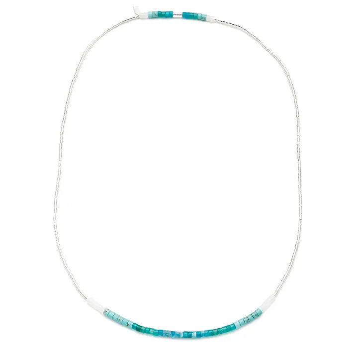 A beaded necklace with a thin silver-toned chain and a curved section of turquoise and light blue beads, shown on a plain white background.