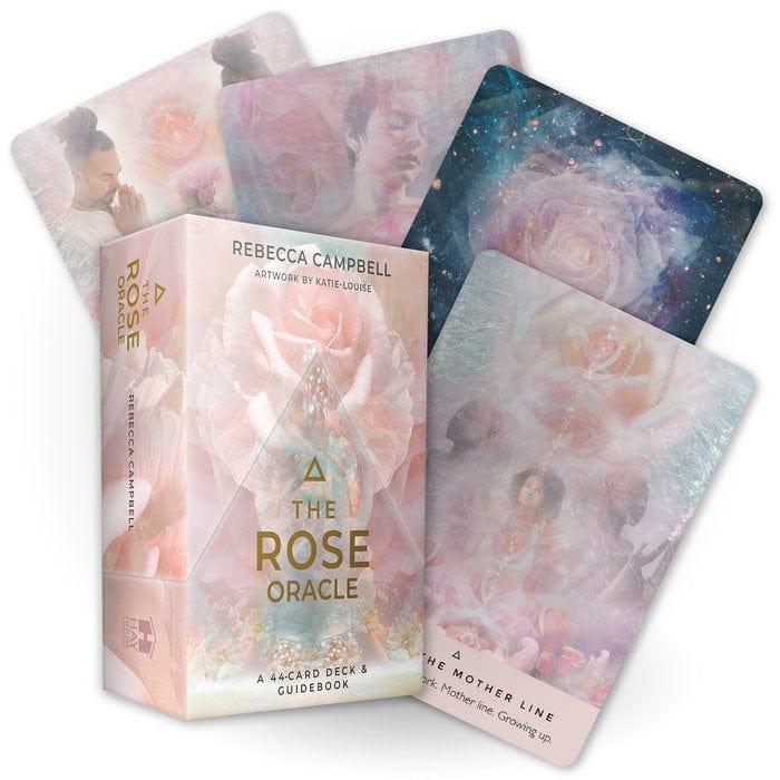 The image shows a boxed oracle deck named 'The Rose Oracle' with visually artistic cards displayed alongside. The cards feature imagery of roses and abstract designs in pastel colors.