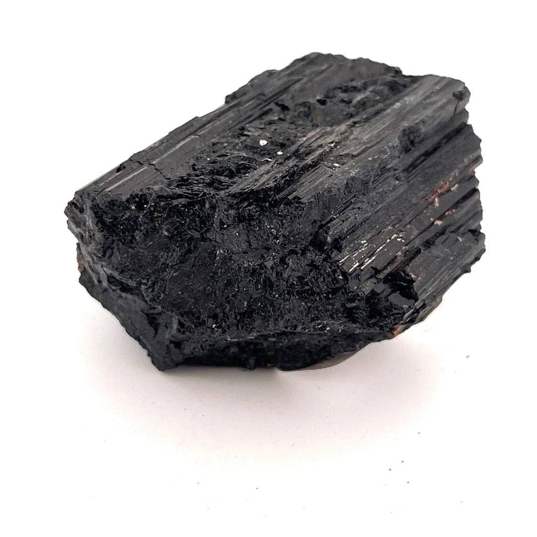 Black tourmaline crystal on a white background