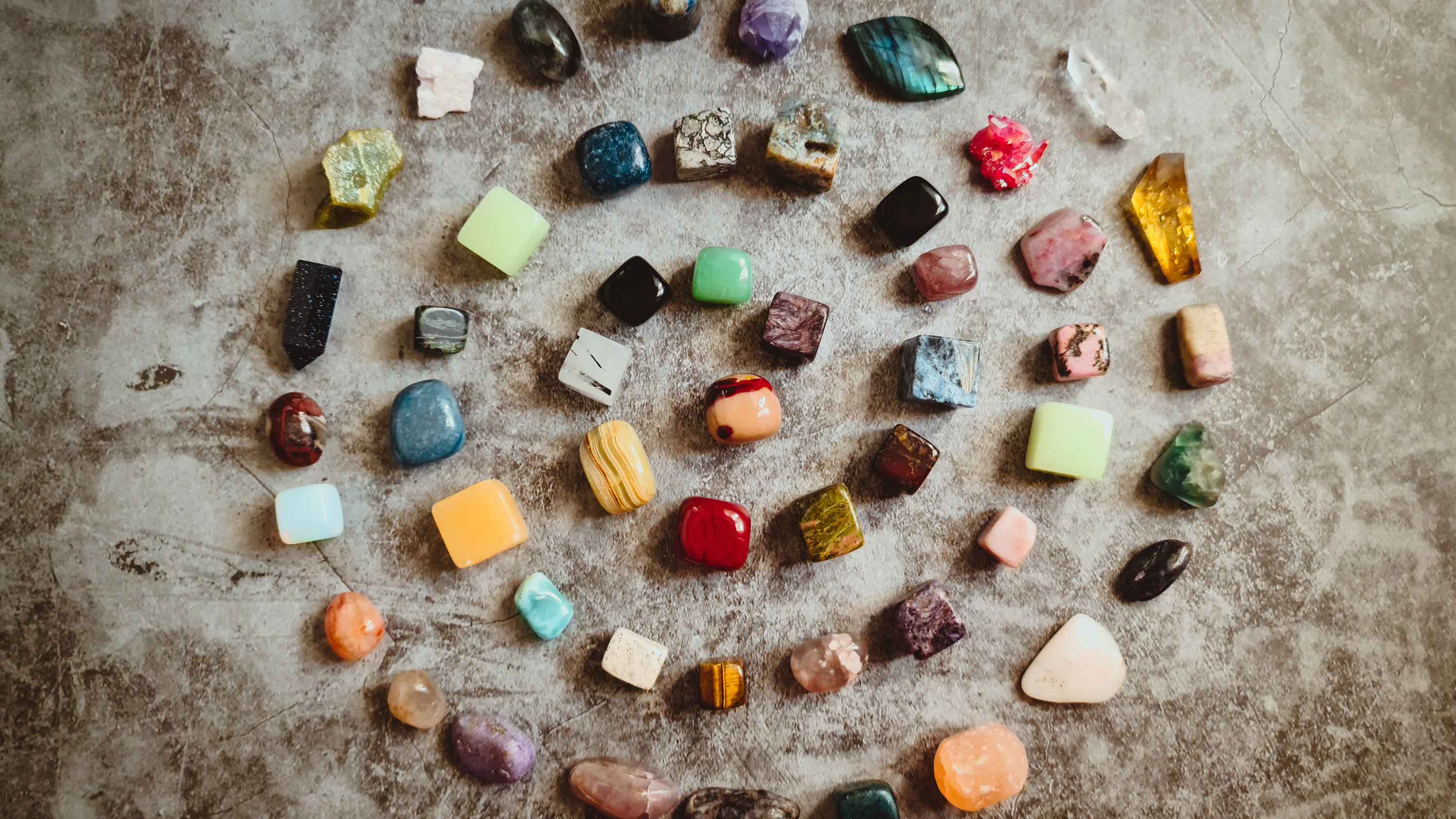 gemstones laid out in a spiral pattern for luck