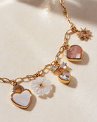 gold charm necklace close up