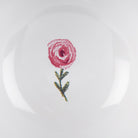 Red rose stamp on a white background inside the mug