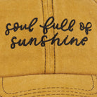 Yellow cap with 'soul full of sunshine' text on a yellow background
