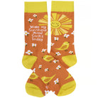 Sunshine-themed socks with a sun, birds, and flowers on an orange background