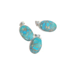 Turquoise stone pendants with silver settings on a white background