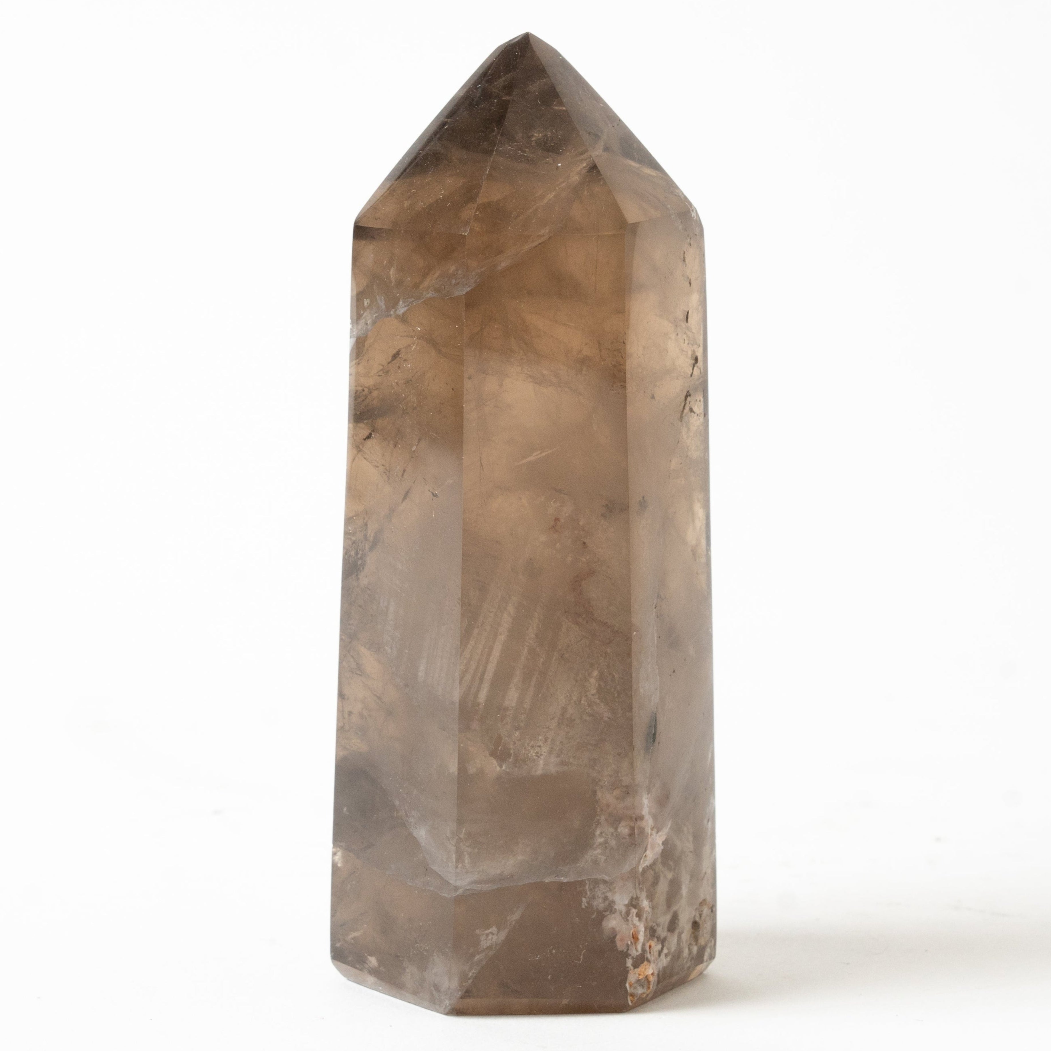 Smoky quartz crystal on a white background