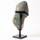 Back of Pink Amethyst Decorative stone head with a black stand on a white background