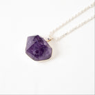 Amethyst crystal Cluster  necklace on a white background