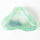 Green fluorite crystal bowl on a white background